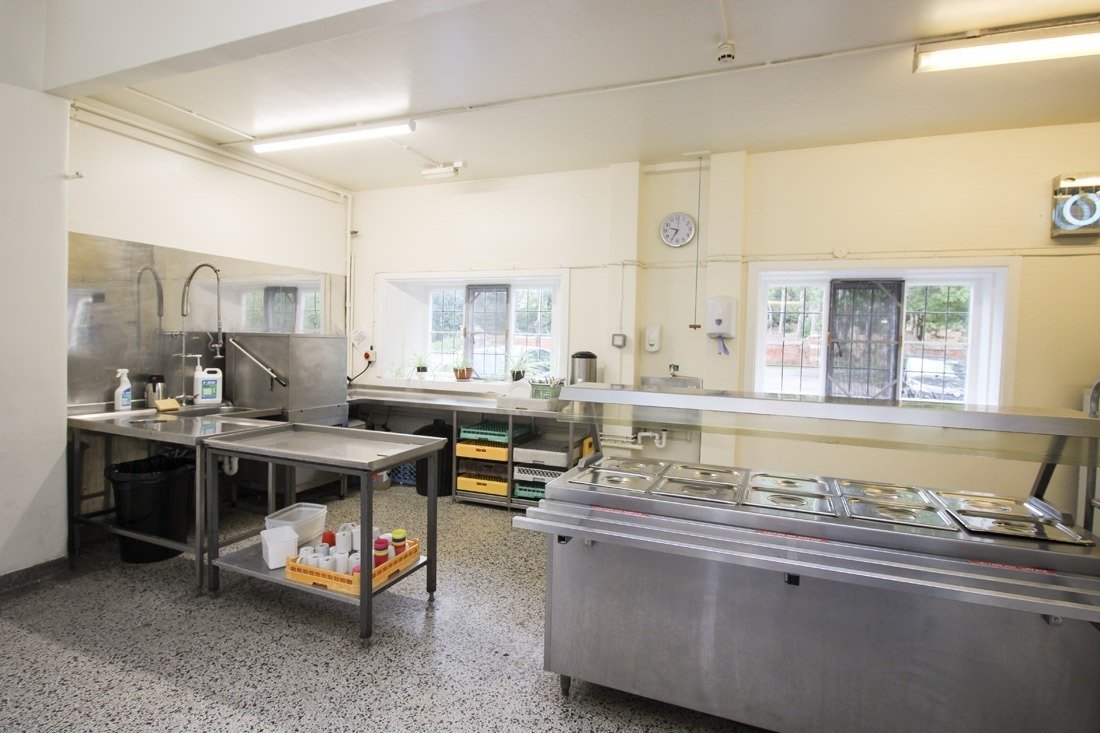 Main house kitchen area in the manor house at avon tyrrell - with serving area for guests